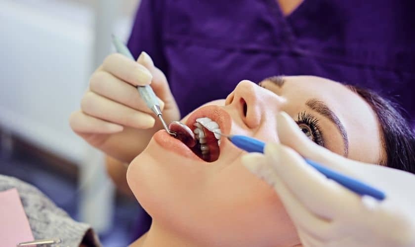 Crown Lengthening Periodontist performing crown lengthening procedure on patient in Phoenix dental office.