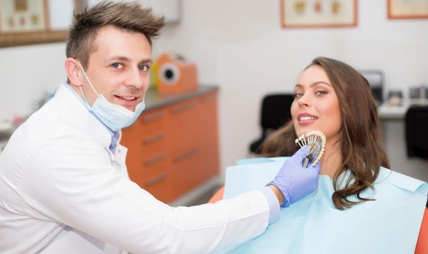 Periodontist in Phoenix (2) (1) Dentist showing patient money, discussing cost of periodontal disease treatment in Phoenix.